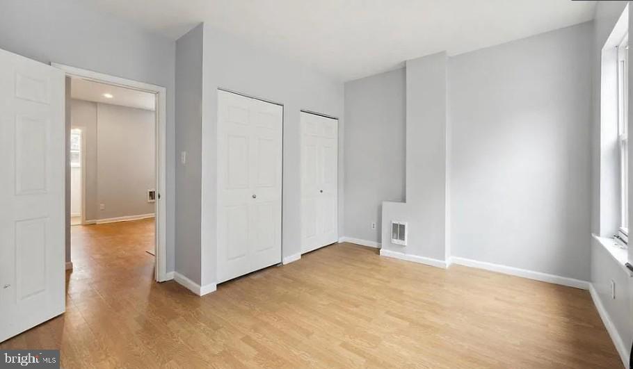 1402 North Newkirk Street, Unit B Philadelphia, PA 19121 - Photo 5 of 9 a view of an empty room with closet and a window