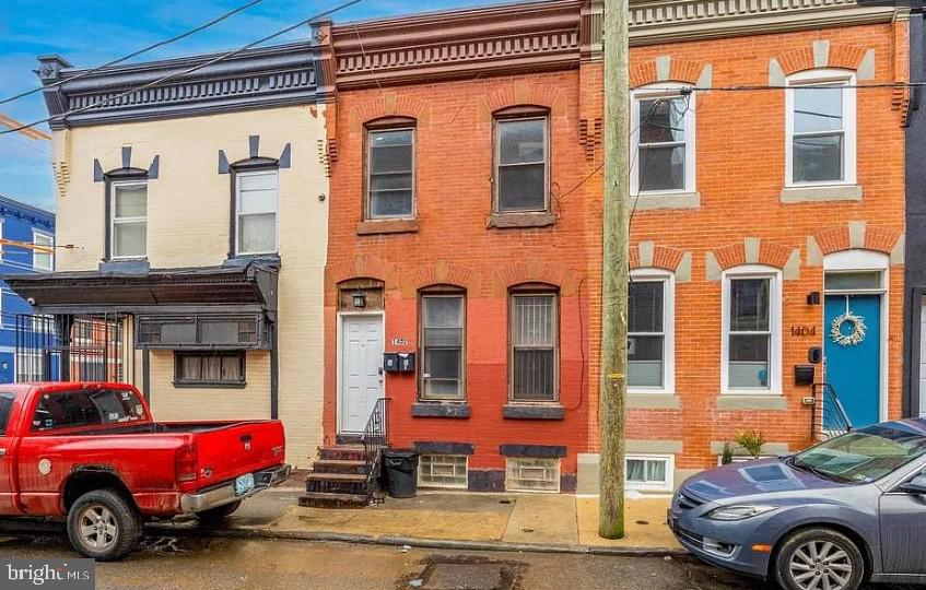 1402 North Newkirk Street, Unit B Philadelphia, PA 19121 - Photo 9 of 9 a front view of a house with parking space