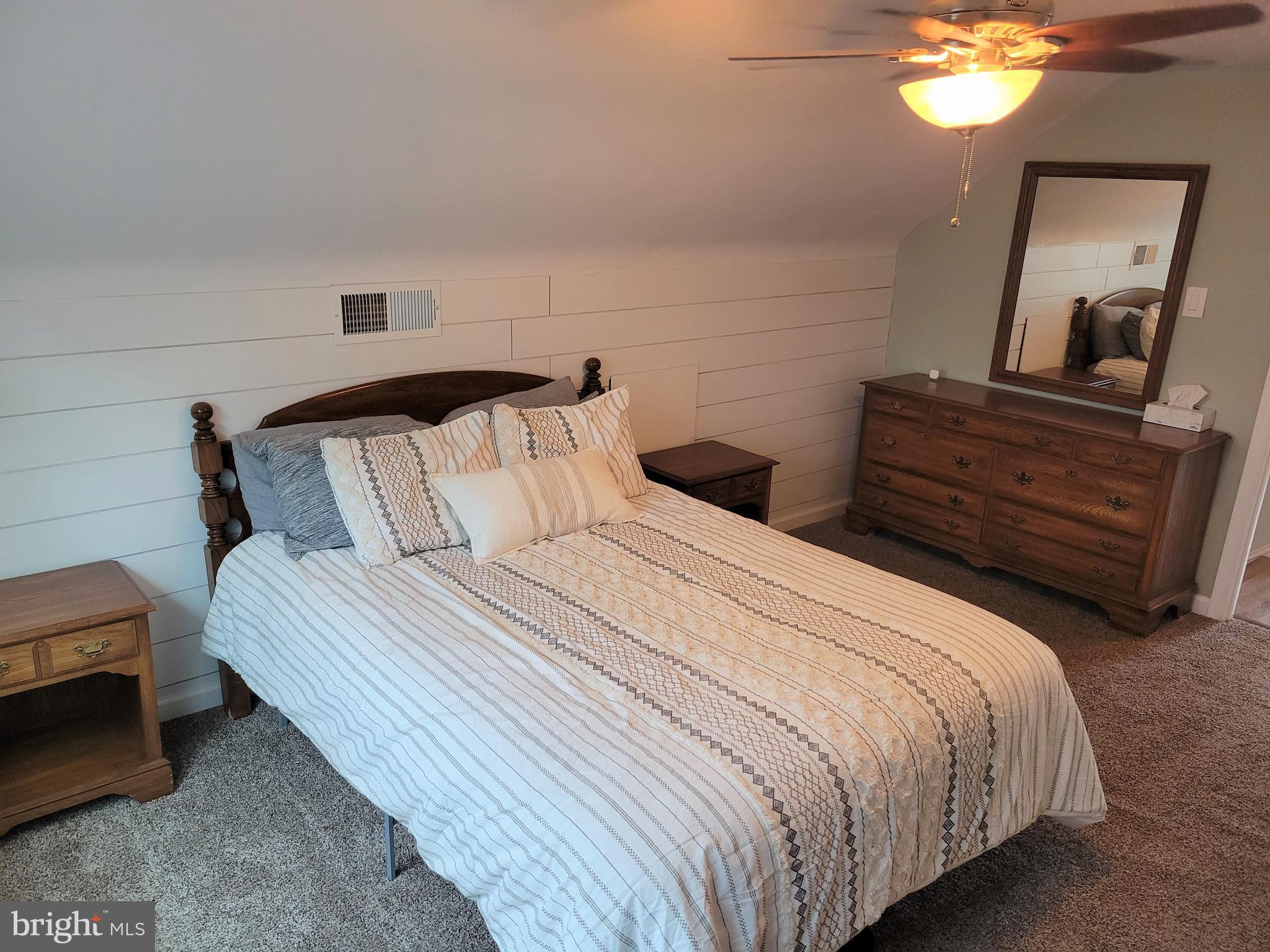 2212 Avon Road Ardmore, PA 19003 - Photo 11 of 23 a bedroom with a bed and a chandelier