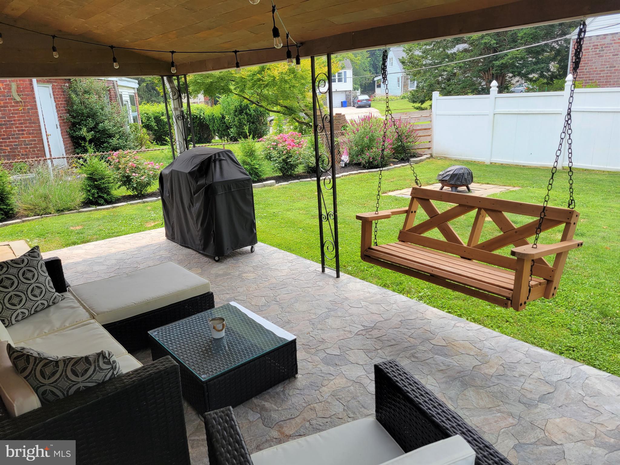 2212 Avon Road Ardmore, PA 19003 - Photo 23 of 23 a view of a patio with a table chairs and a backyard