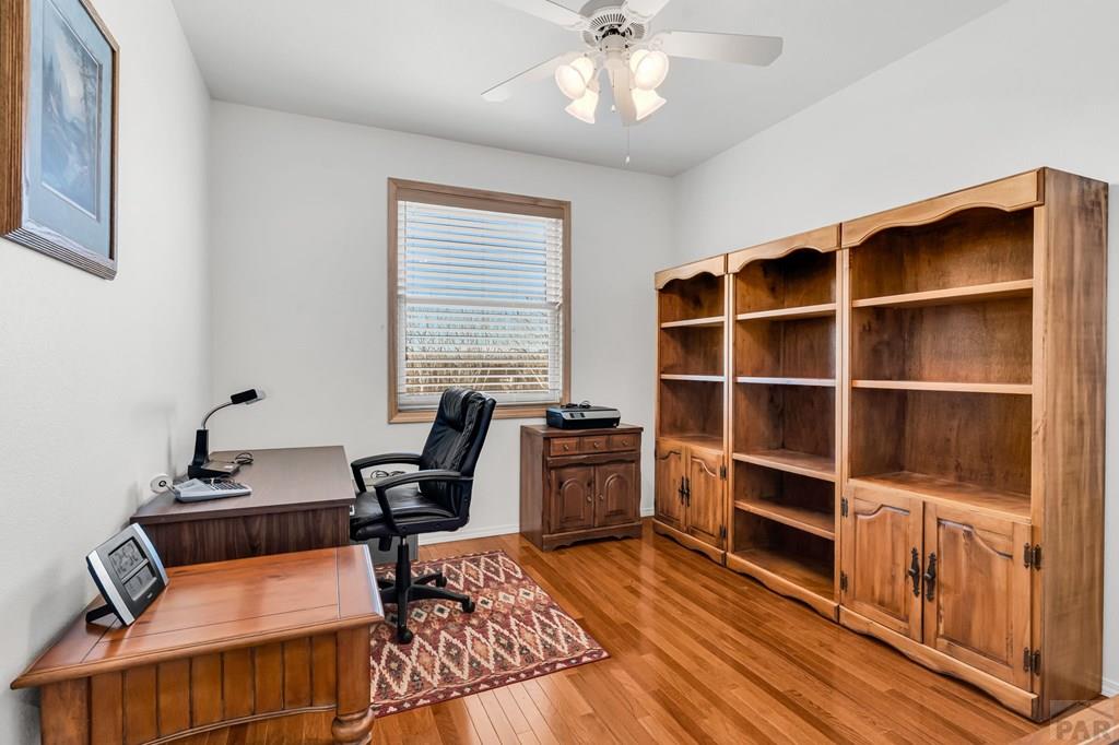 2064 Iris Road Pueblo, CO 81006 - Photo 15 of 56 a view of a workspace with furniture and a window