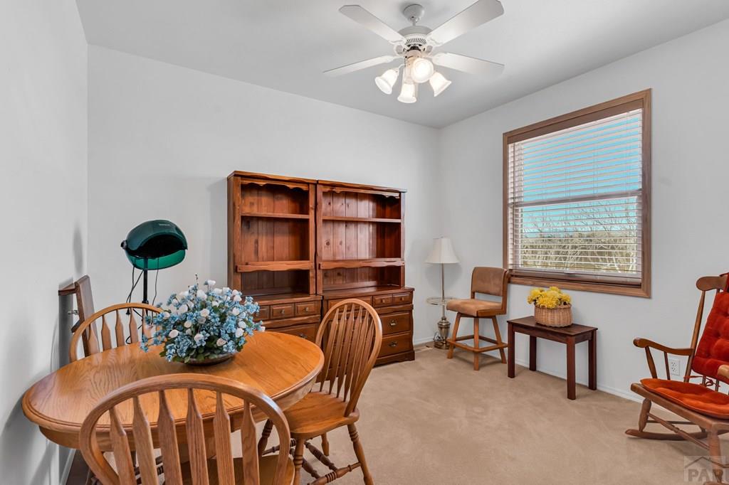 2064 Iris Road Pueblo, CO 81006 - Photo 16 of 56 a living room with furniture and a window