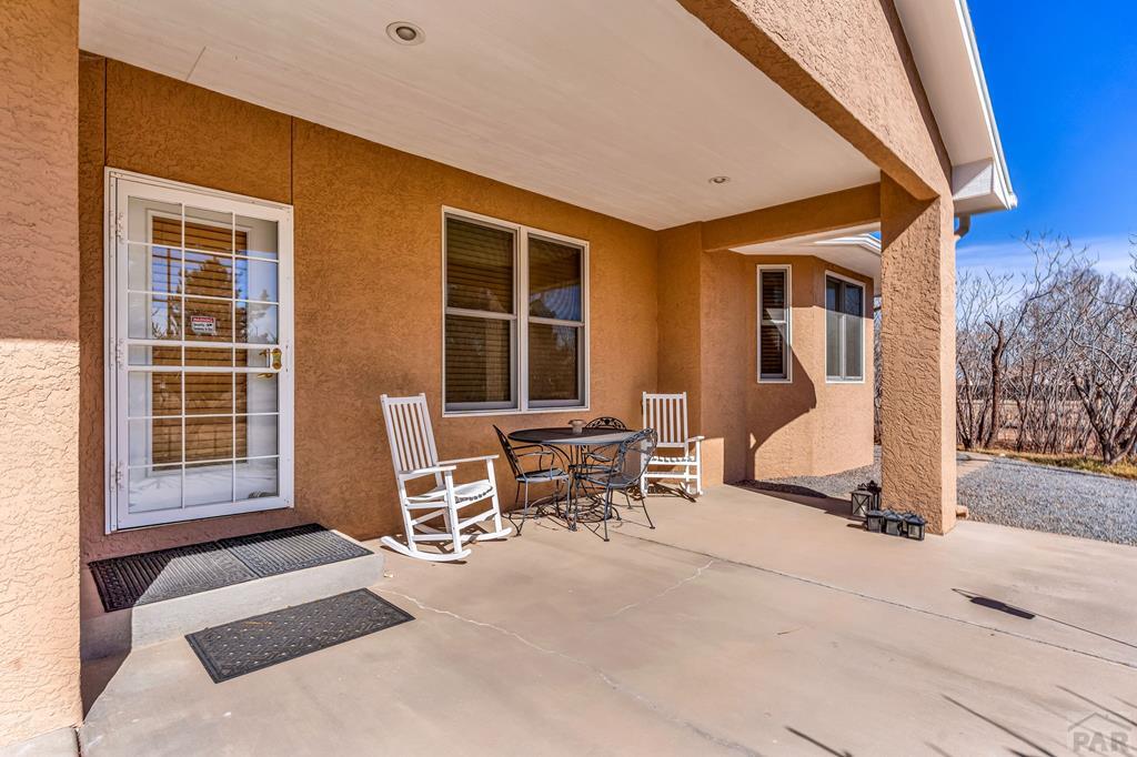2064 Iris Road Pueblo, CO 81006 - Photo 31 of 56 a view of a livingroom with furniture and front door