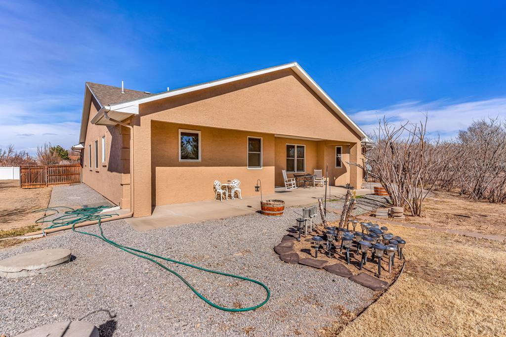 2064 Iris Road Pueblo, CO 81006 - Photo 33 of 56 a view of a house with backyard