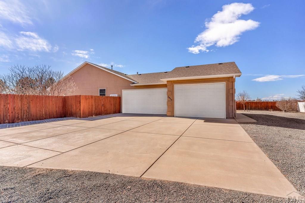 2064 Iris Road Pueblo, CO 81006 - Photo 41 of 56 a view of a house with a yard
