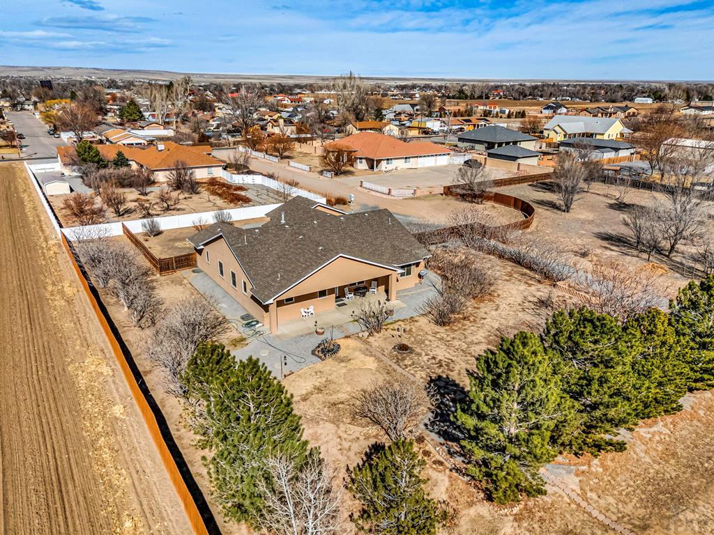 2064 Iris Road Pueblo, CO 81006 - Photo 47 of 56 an aerial view of residential houses with outdoor space
