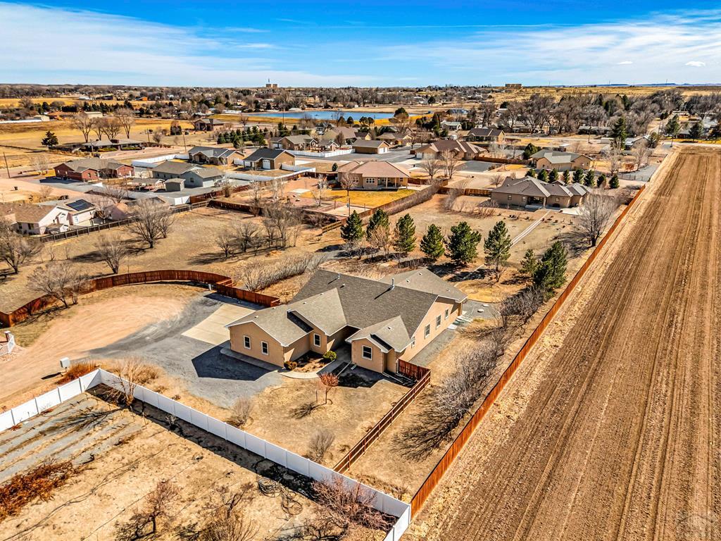 2064 Iris Road Pueblo, CO 81006 - Photo 50 of 56 an aerial view of residential houses with outdoor space