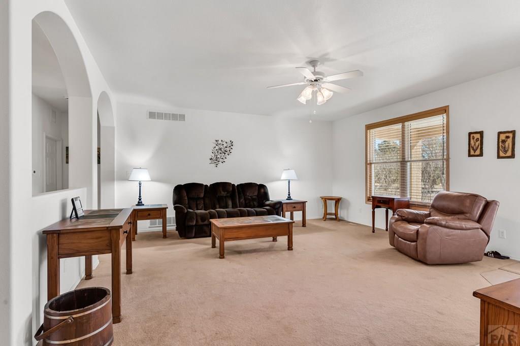 2064 Iris Road Pueblo, CO 81006 - Photo 5 of 56 a living room with furniture and a window