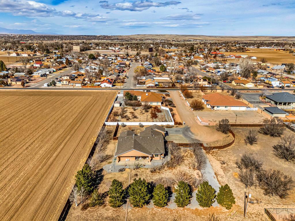 2064 Iris Road Pueblo, CO 81006 - Photo 51 of 56 an aerial view of residential houses with outdoor space