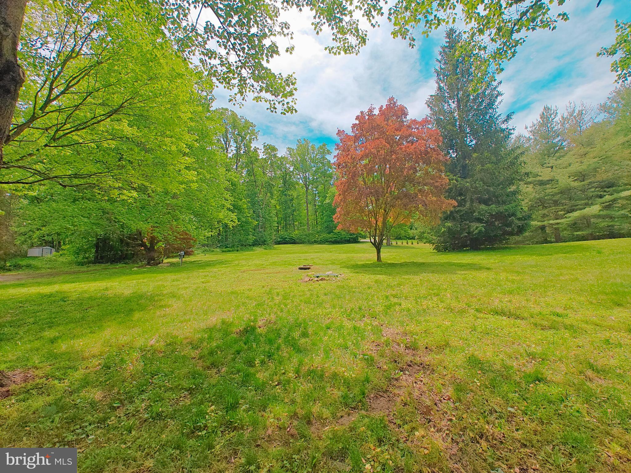 152 Icedale Road Honey Brook, PA 19344 - Photo 5 of 18 a backyard of a house with lots of green space and fountain
