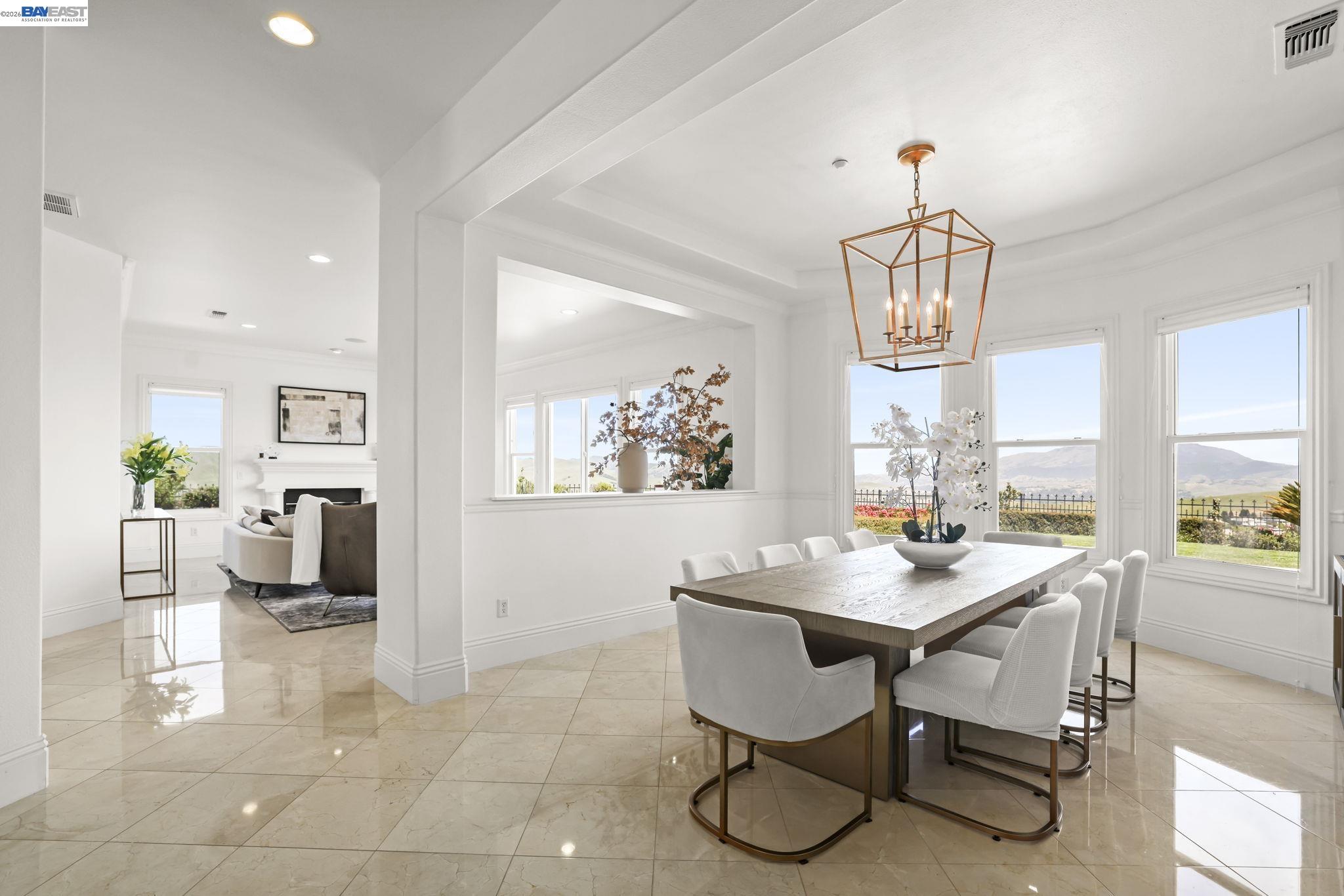 950 Winsford Court San Ramon, CA 94583 - Photo 9 of 68 a view of a dining room with furniture a chandelier and wooden floor