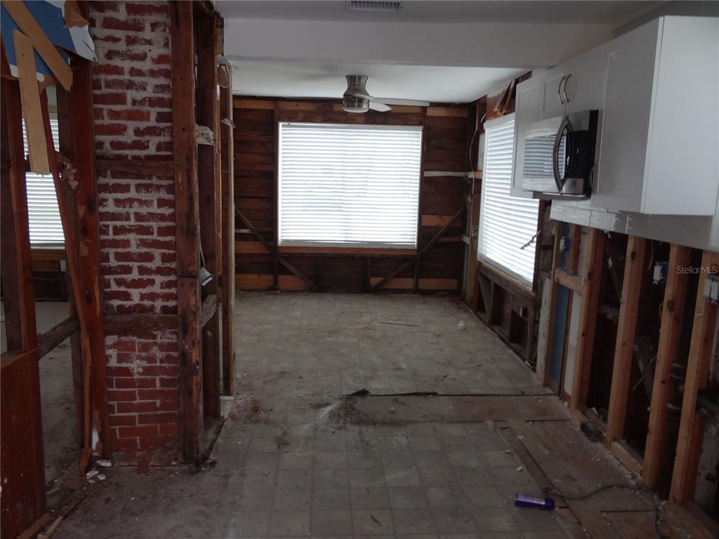 14117 Palm Street Madeira Beach, FL 33708 - Photo 13 of 25 a view of entryway with a flat screen tv