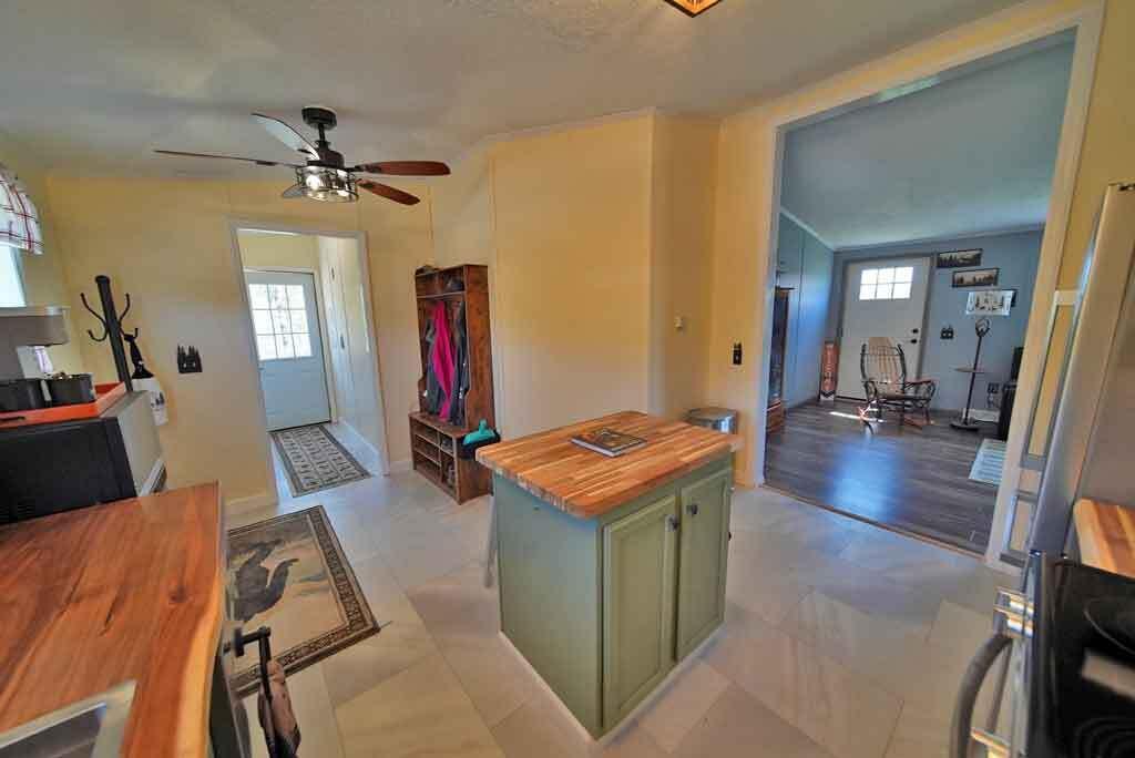 3157 Military Road Haynesville, ME 04497 - Photo 27 of 47 island-kitchen-arch-way