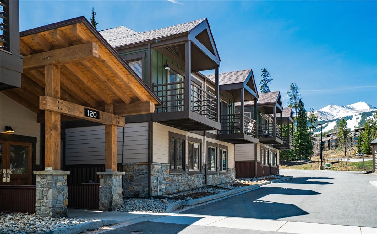 120 Sawmill Road, Unit 106 Breckenridge, CO 80424 - Photo 1 of 25 a front view of a building with street