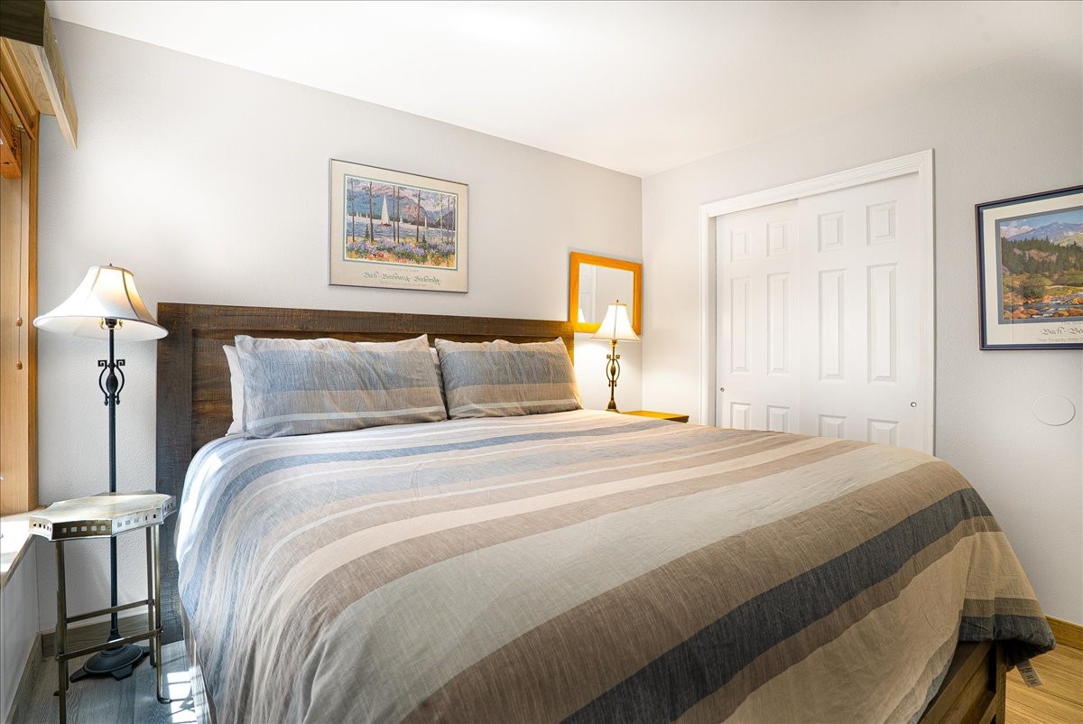 120 Sawmill Road, Unit 106 Breckenridge, CO 80424 - Photo 12 of 25 a bedroom with a bed and a window