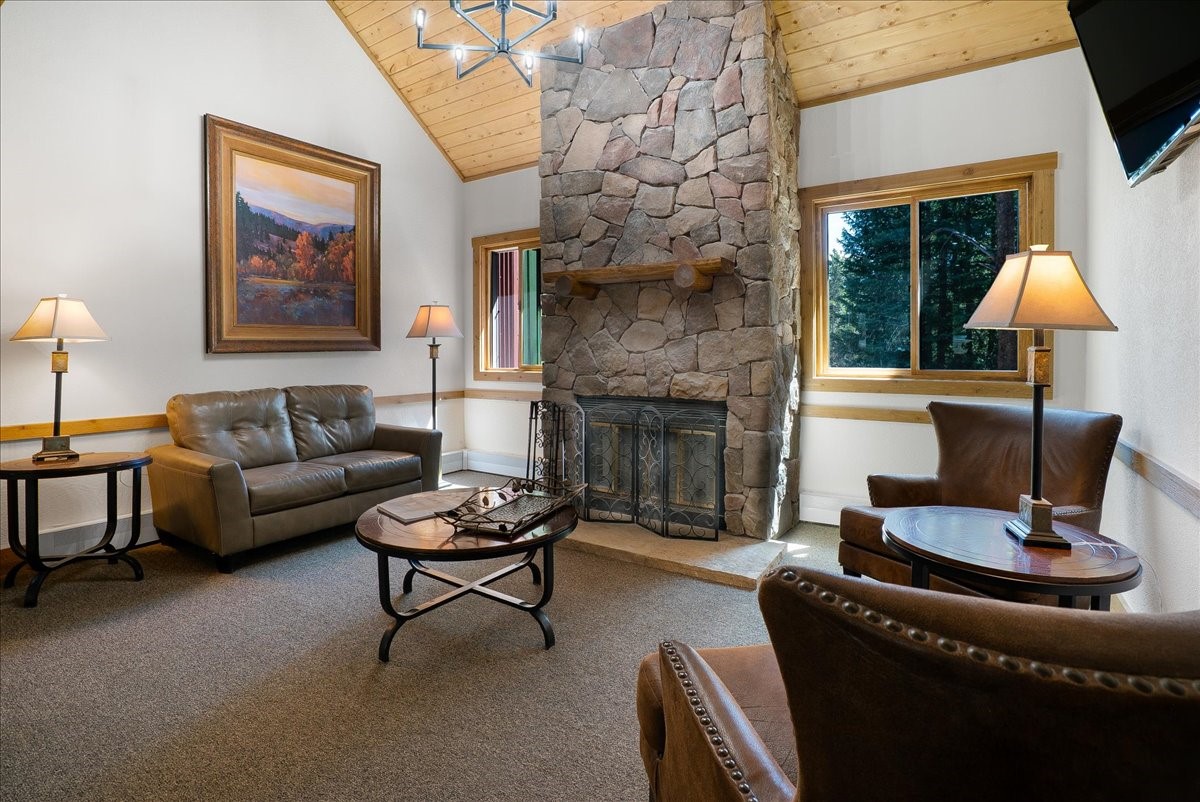 120 Sawmill Road, Unit 106 Breckenridge, CO 80424 - Photo 16 of 25 a living room with furniture and a fireplace