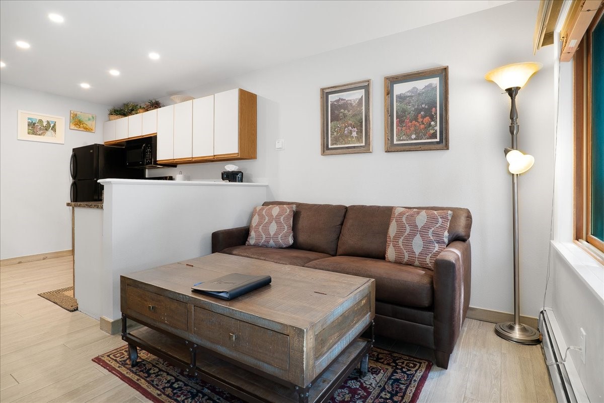 120 Sawmill Road, Unit 106 Breckenridge, CO 80424 - Photo 4 of 25 a living room with furniture and a couch