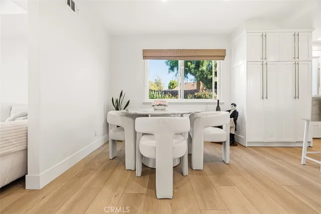 a dining room with furniture window wooden floor