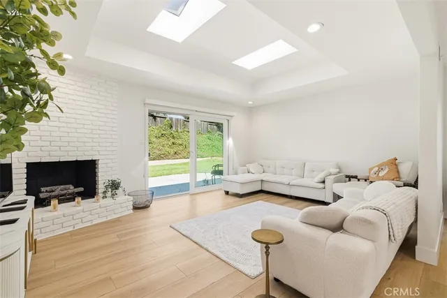 a living room with furniture fireplace and a flat screen tv