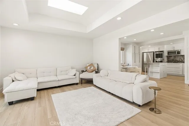 a living room with furniture and white walls