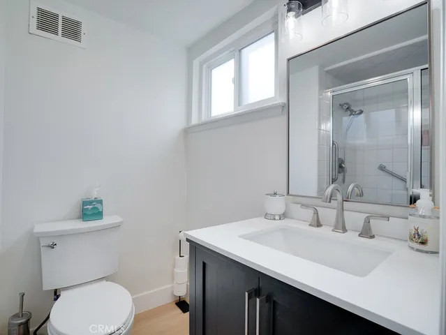 a bathroom with a sink toilet and vanity