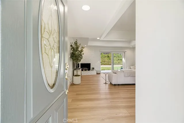a view of living room with furniture and a large window