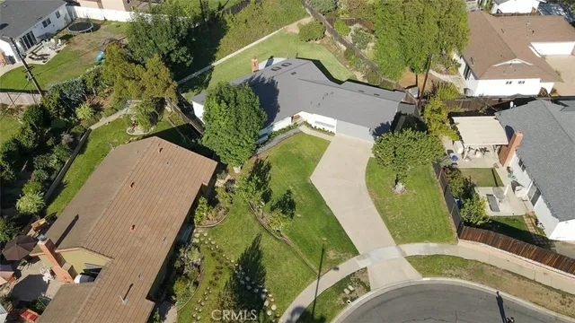 an aerial view of residential house with outdoor space and swimming pool