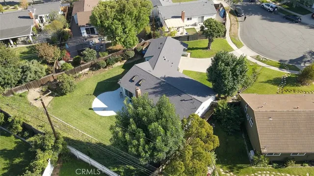 an aerial view of a house with a swimming pool