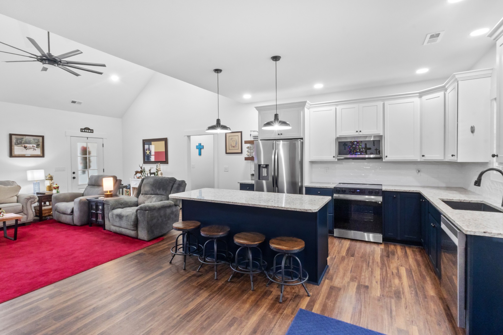249 Claypool Road Bethpage, TN 37022 - Photo 12 of 53 a kitchen with stainless steel appliances granite countertop a dining table chairs stove refrigerator and cabinets