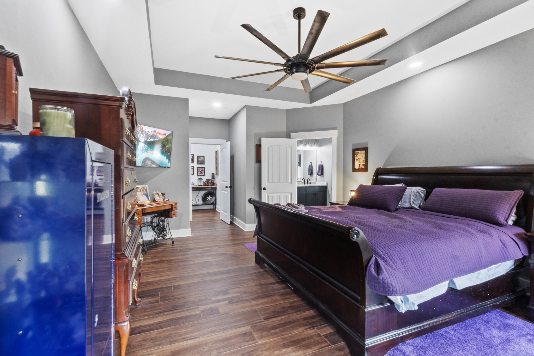 249 Claypool Road Bethpage, TN 37022 - Photo 20 of 53 a spacious bedroom with a bed and a chandelier