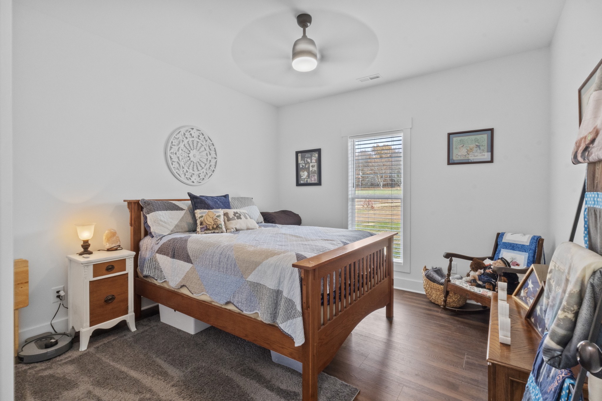 249 Claypool Road Bethpage, TN 37022 - Photo 30 of 53 a bedroom with a bed and a chandelier