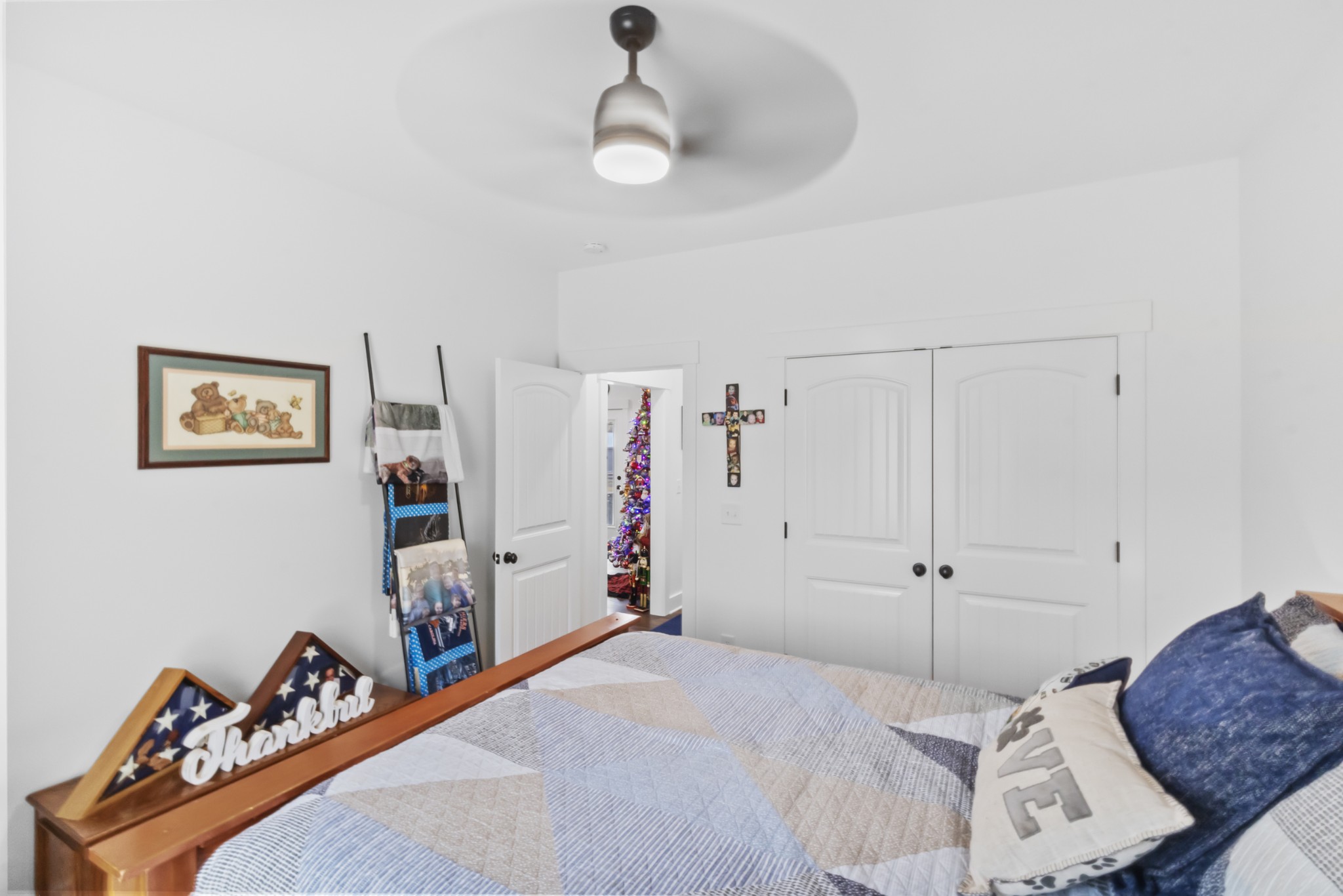 249 Claypool Road Bethpage, TN 37022 - Photo 32 of 53 a bedroom with a bed and a chandelier