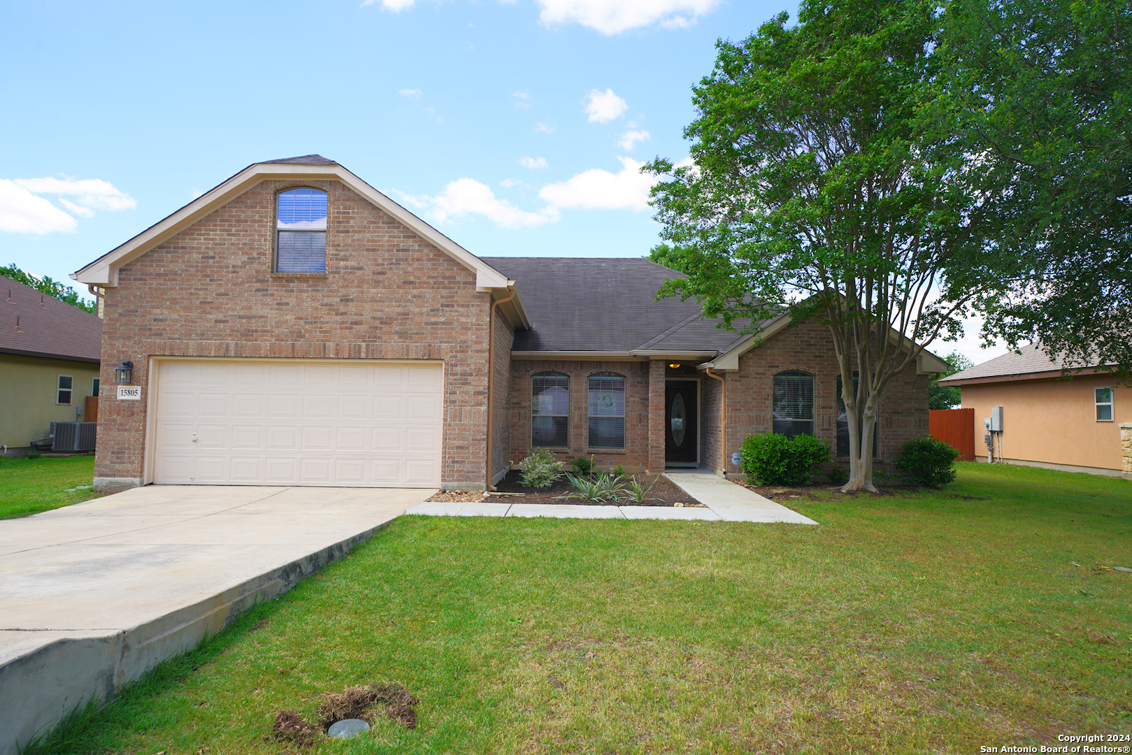 15805 Fair Lane Selma, TX 78154 - Photo 1 of 50 a front view of a house with garden