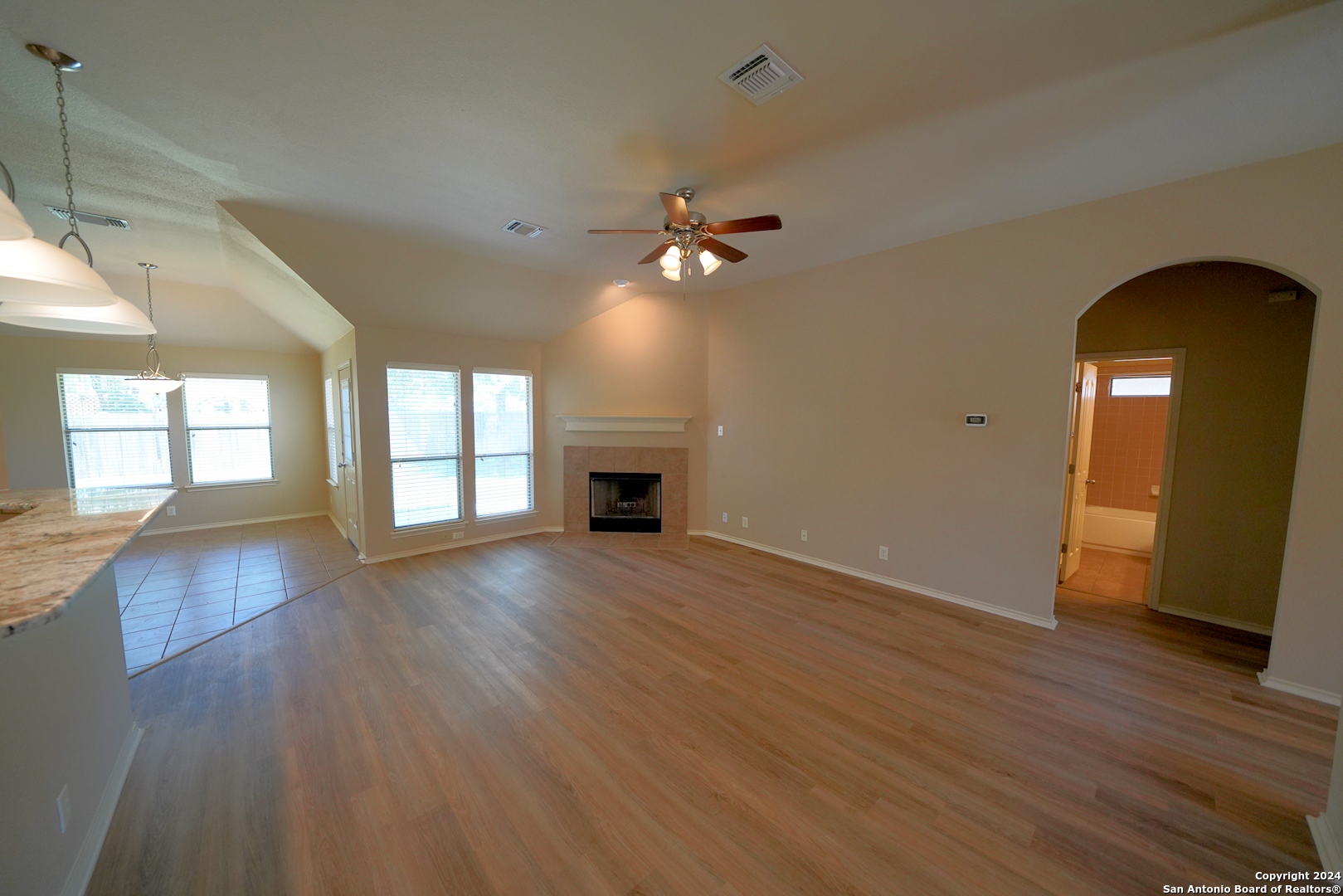 15805 Fair Lane Selma, TX 78154 - Photo 12 of 50 a view of an empty room with window and wooden floor