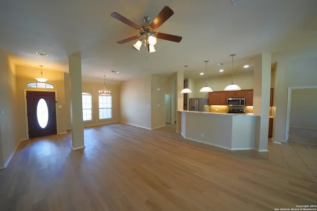 a view of kitchen with cabinets and wooden floor