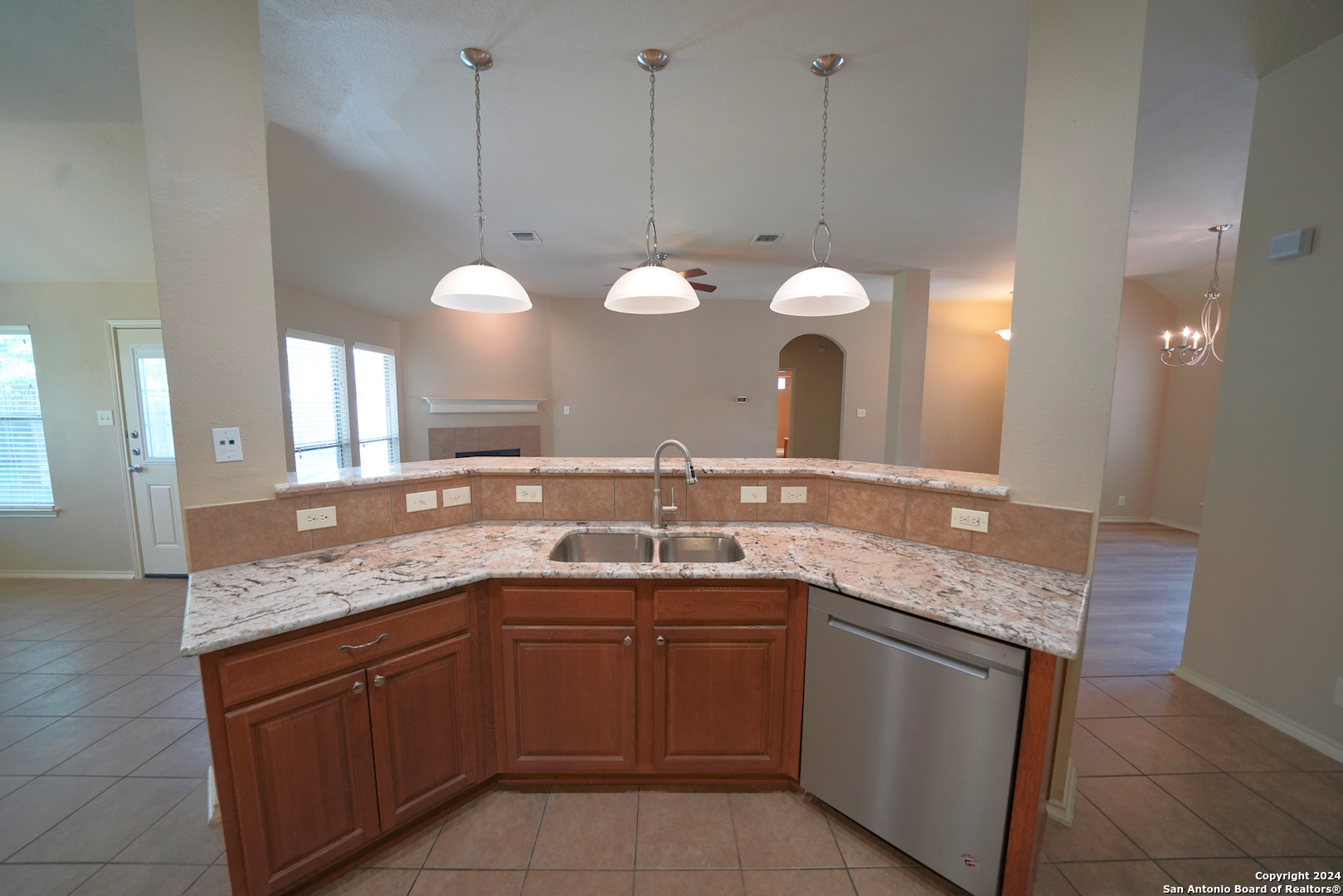 15805 Fair Lane Selma, TX 78154 - Photo 19 of 50 a kitchen with a sink and a mirror
