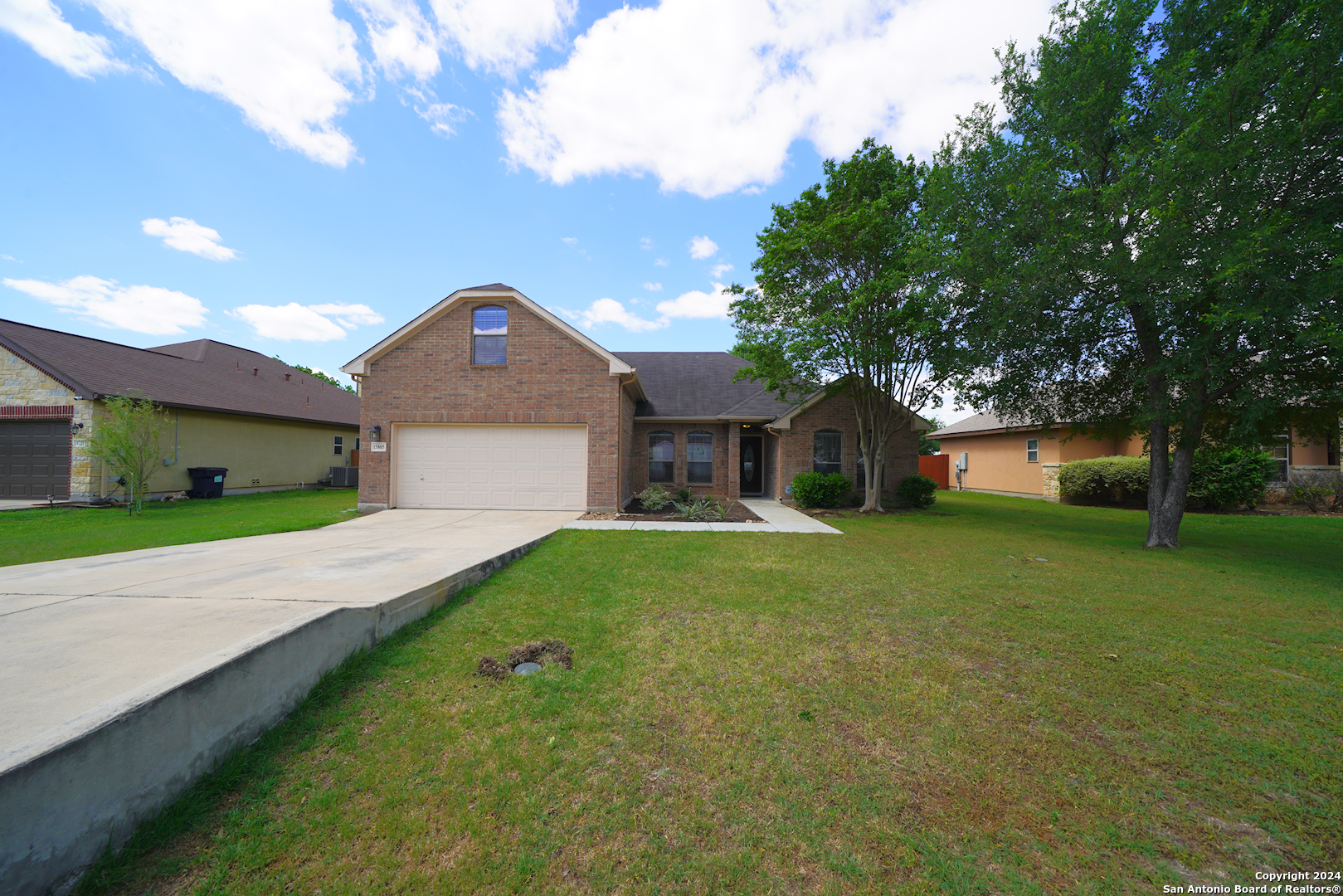 15805 Fair Lane Selma, TX 78154 - Photo 2 of 50 a front view of a house with a yard and garage