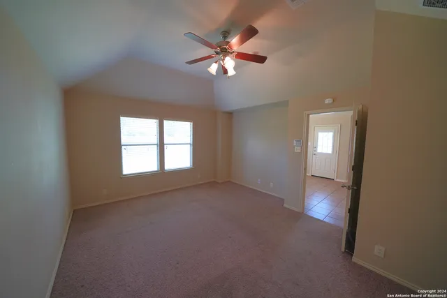 a view of an empty room with a window