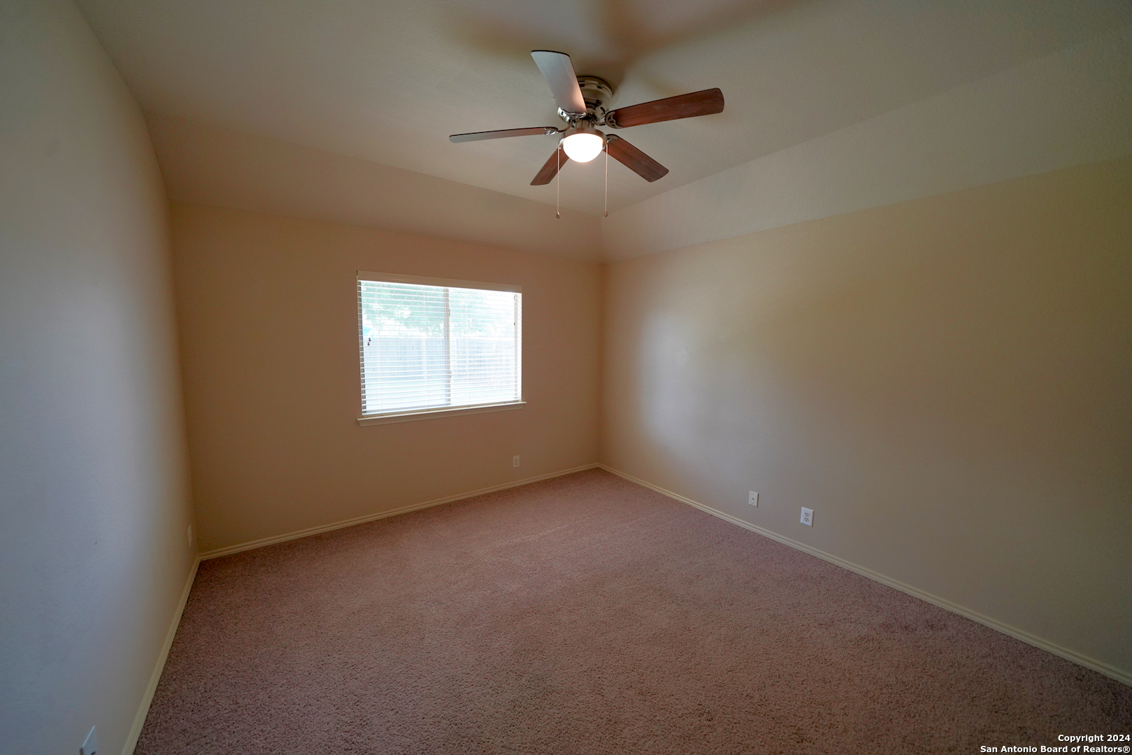 15805 Fair Lane Selma, TX 78154 - Photo 31 of 50 an empty room with a window and a fan