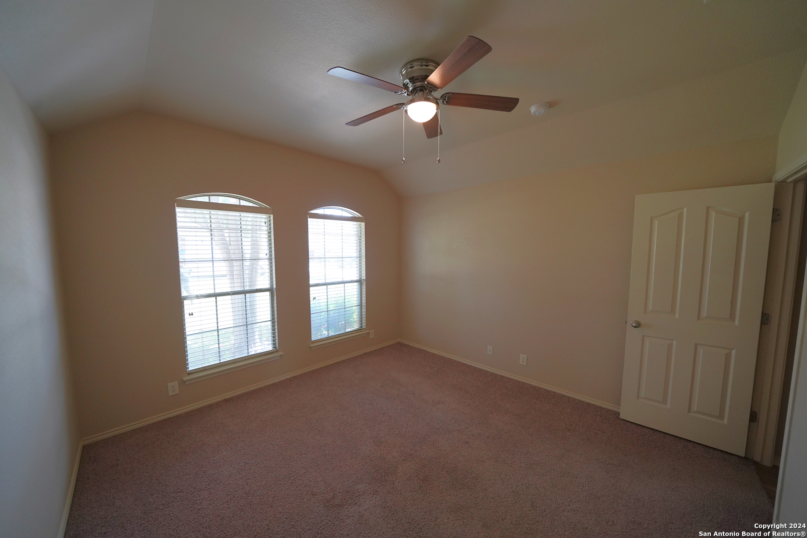 15805 Fair Lane Selma, TX 78154 - Photo 36 of 50 an empty room with windows and fan