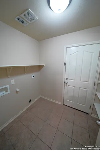 a view of storage and utility room with empty racks
