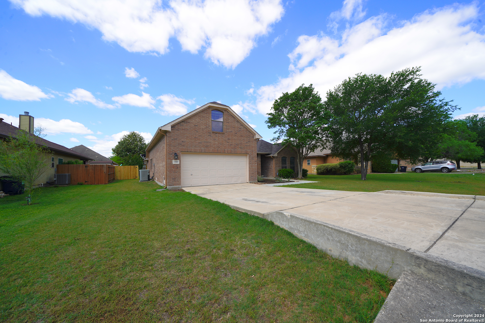 15805 Fair Lane Selma, TX 78154 - Photo 4 of 50 a front view of a house with garden
