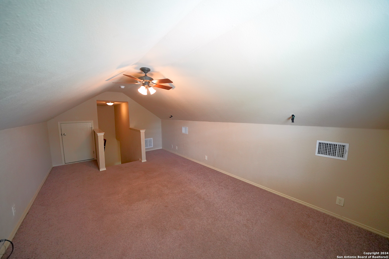 15805 Fair Lane Selma, TX 78154 - Photo 43 of 50 a view of a big room with a chandelier fan and a window