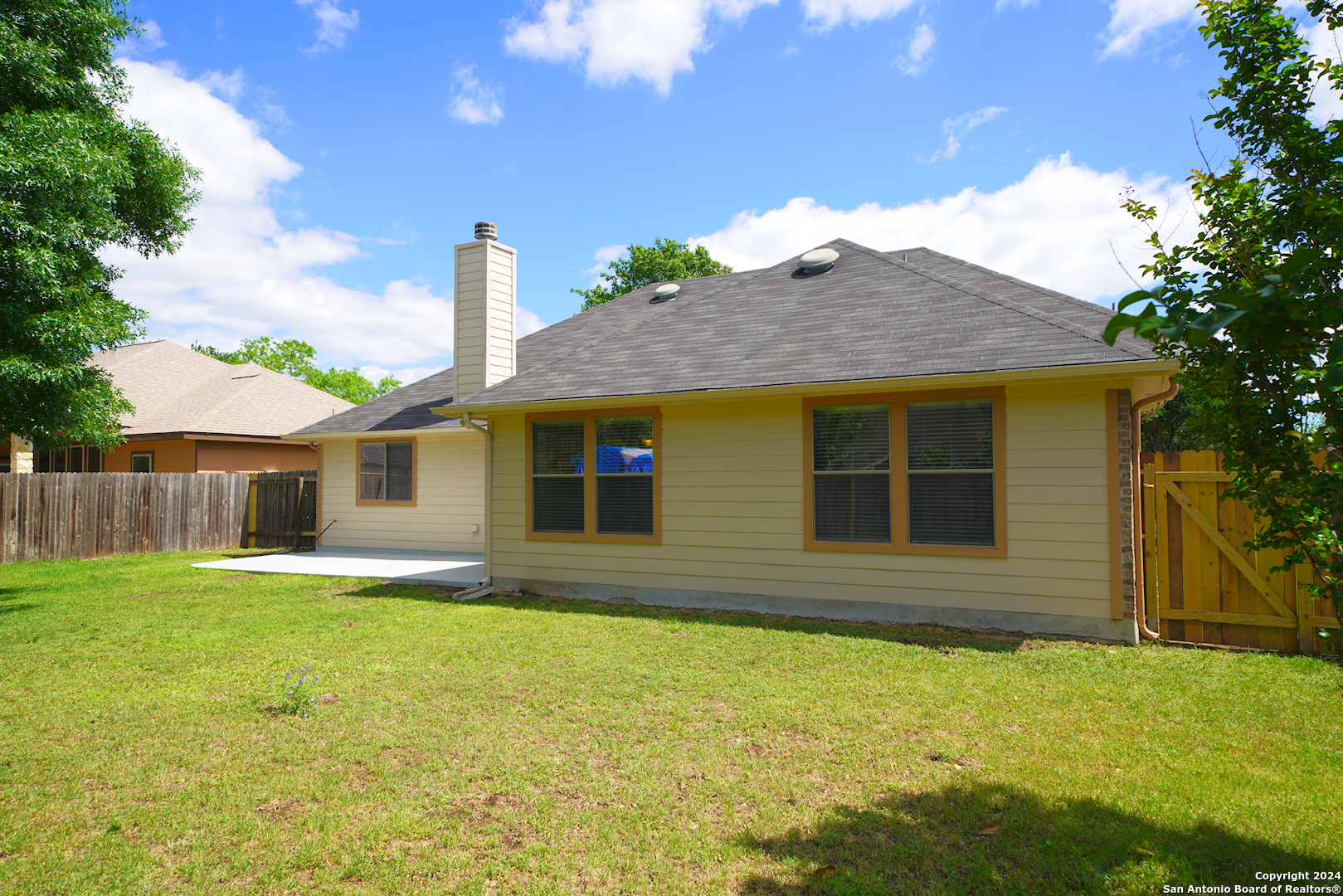 15805 Fair Lane Selma, TX 78154 - Photo 49 of 50 a front view of house with yard and trees in the background
