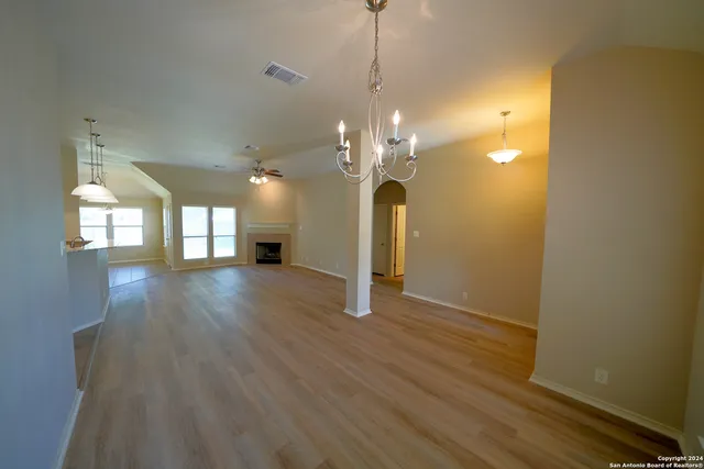a view of a room with wooden floor