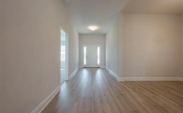 a bathroom with a double vanity sink a large mirror and shower
