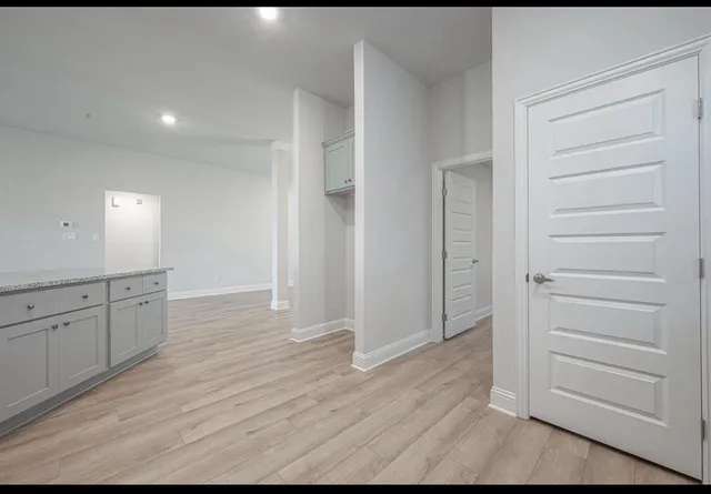 a view of a dining room with furniture wooden floor and chandelier