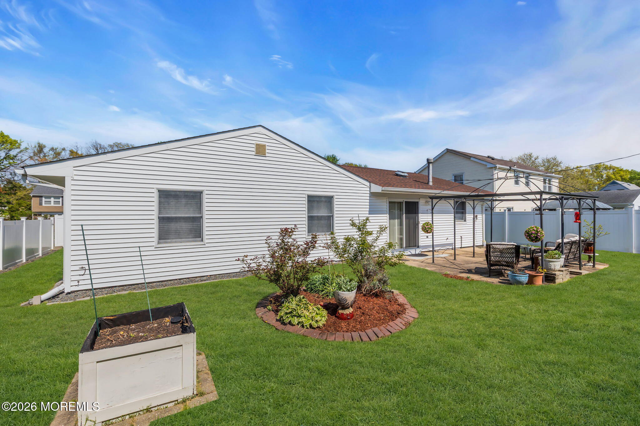 101 Andover Lane Matawan, NJ 07747 - Photo 48 of 51 a front view of house with a garden and patio