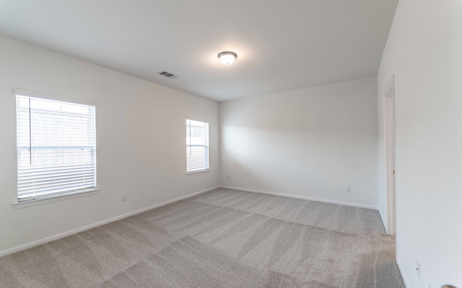 428 Monarch Trail Huntsville, TX 77340 - Photo 12 of 16 an empty room with windows