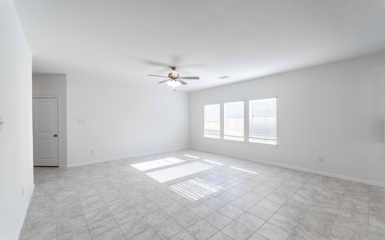 428 Monarch Trail Huntsville, TX 77340 - Photo 5 of 16 a view of an empty room with a window